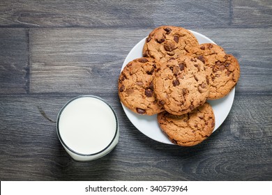 Chocolate Chip Cookies, Milk, Rustic Wood Background, Top View 