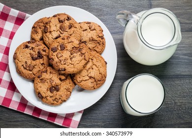 Chocolate Chip Cookies, Milk, Rustic Wood Background, Top View 