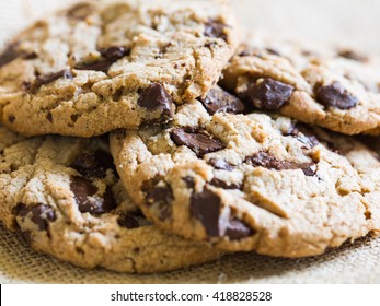 Chocolate chip cookies on brown cloth background 