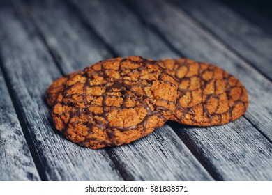 chocolate chip cookies on a gray wooden background.