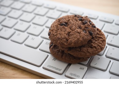 Chocolate Chip Cookies On Keyboard Computer Background Copy Space. Cookies Website Internet Homepage Policy Accepted Or Blocks Concept.