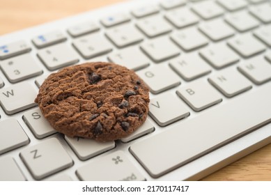 Chocolate Chip Cookies On Keyboard Computer Background Copy Space. Cookies Website Internet Homepage Policy Accepted Or Blocks Concept.