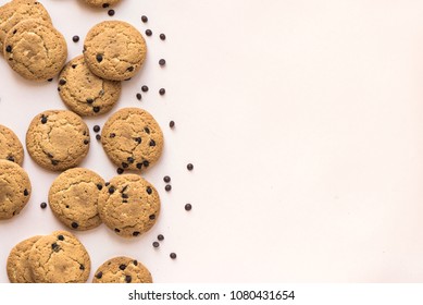 Chocolate Chip Cookies On Pink Pastel Background, Top View, Copy Space