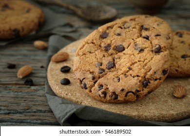 Chocolate chip cookies stacked up on a plate in low light, 
AF point selection - Powered by Shutterstock