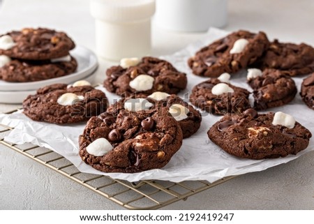 Chocolate chip and marshmallow dark chocolate cookies served with milk