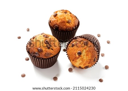 Chocolate chip muffins isolated on white background.	