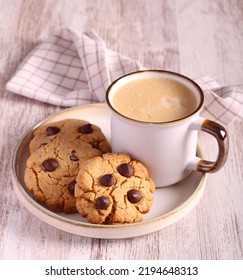 Chocolate Chip Peanut Butter Cookies And Cup Of Coffee