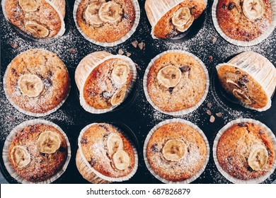 Chocolate Chips Banana Muffins On Rustic Background