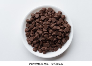 Chocolate Chips in a White Bowl - Shutterstock ID 722086612