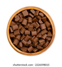 Chocolate chunks, in a wooden bowl. Chips and small morsels of milk chocolate, used as an ingredient in a number of sweet desserts, notably chocolate chip cookies and muffins, or also in trail mix. - Powered by Shutterstock