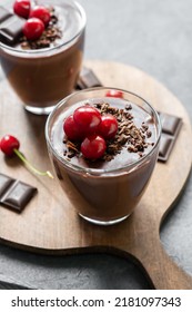 Chocolate Cocoa Pudding With Sour Cherry, Mousse In Glass Cup On Rustic Table, Supangle