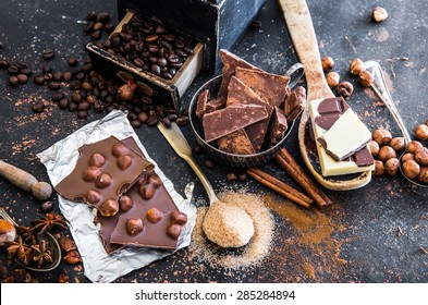 chocolate, cocoa and various spices on black table - Shutterstock ID 285284894