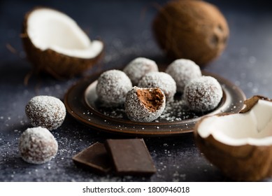 Chocolate coconut energy balls rolled in coconut.
