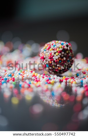 Similar – Dot on chocolate Candy