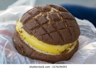 Chocolate concha bread filled with creme