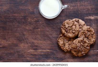 chocolate cookies with chocolate chips on a wooden table - Powered by Shutterstock