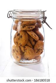 Chocolate  Cookies In A Glass Jar On Wooden Table