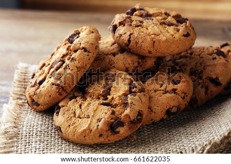 Chocolate cookies on wooden table.  