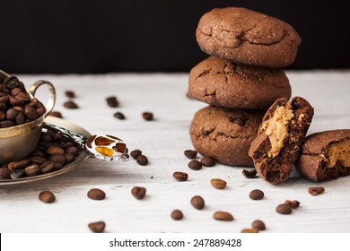 Chocolate Cookies With Peanut Butter On A Dark Background