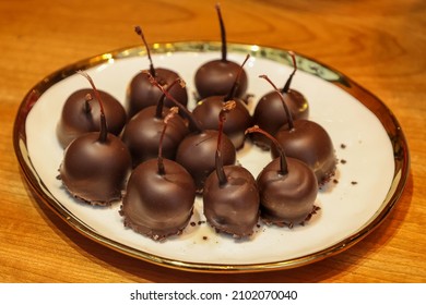 Chocolate Covered Cherries On A Plate. 