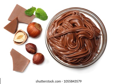 chocolate cream with hazelnut isolated on white background. cream in glass bowl. top view - Shutterstock ID 1055843579