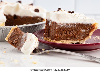 A Chocolate Cream Pie Topped with Chocolate Chips and Cocoa on Whipped Cream - Shutterstock ID 2251586169