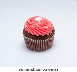 Chocolate cupcake decorated with red pink icing and sprinkles isolated on white
 - Shutterstock ID 2087938966