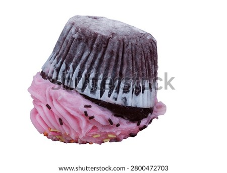 Chocolate cupcake lying upside down with crushed pink frosting isolated on a white background. Concept image representing failure, disappointment, mistakes, setbacks and things going wrong.