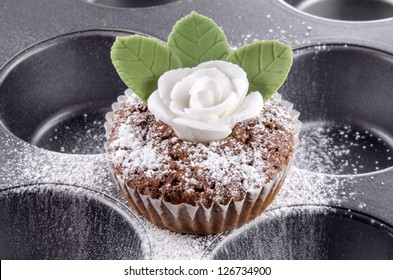 Chocolate Cupcake With Marzipan Rose On A Baking Tray