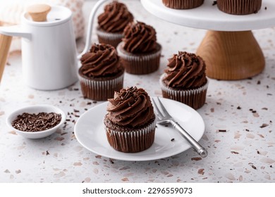 Chocolate cupcakes with dark chocolate whipped ganache frosting and chocolate sprinkles - Powered by Shutterstock