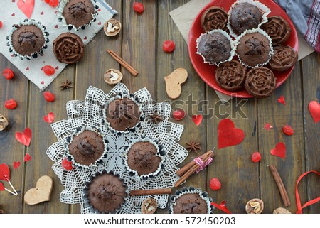 Chocolate cupcakes on the day of lovers and various ornaments in the shape of heart