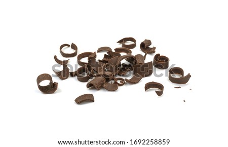 Chocolate Curls Isolated On White Background. Group of chocolate shavings. CHOCOLATE ROLL.