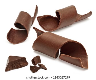 Chocolate curls and parts or broken chocolate morsels isolated on white background with clipping path