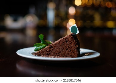 Chocolate Dessert Decorated With Mint. Piece Of Cake Side View.