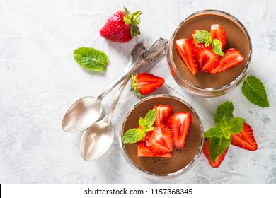 Chocolate dessert of whipped cream and strawberries in glass. - Powered by Shutterstock