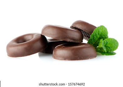 Chocolate Donut Cookies With Green Mint Leaves On Whute Background.