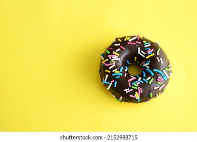 Chocolate Donut With Rainbow Sprinkles Isolated, Close-up