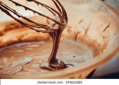 chocolate dough on the wire whisk - Powered by Shutterstock