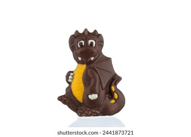 Chocolate dragon candy.
Chocolate in the form of a Dragon on a white background.
A chocolate dragon sculpture against a white backdrop.