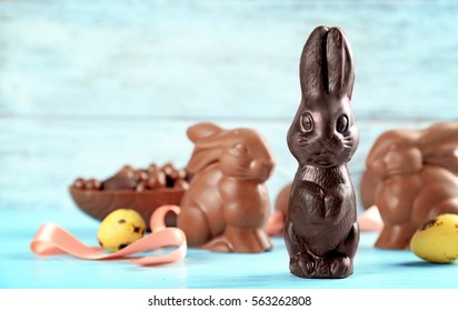 Chocolate Easter Bunnies On Color Background