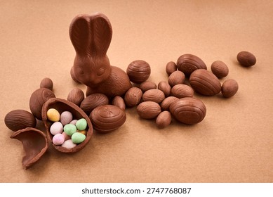 Chocolate easter bunny with eggs and candy treats