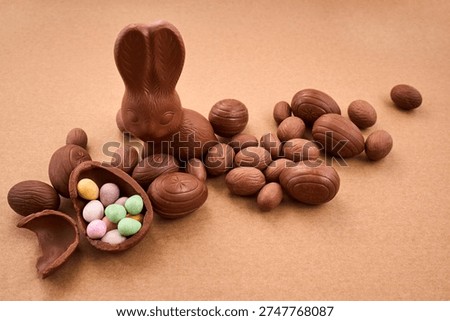 Chocolate easter bunny with eggs and candy treats