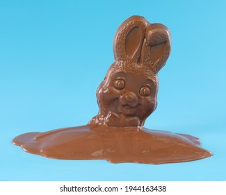 Chocolate Easter bunny rabbit melting into a puddle. Disappointment Easter concept.