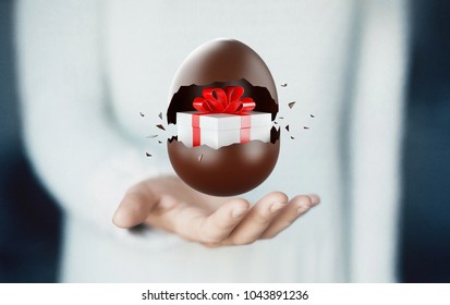 Chocolate Easter egg on hand