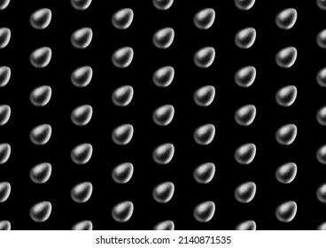 Chocolate easter egg pattern with silver Aluminium foil on black background. Wallpaper. backdrop.