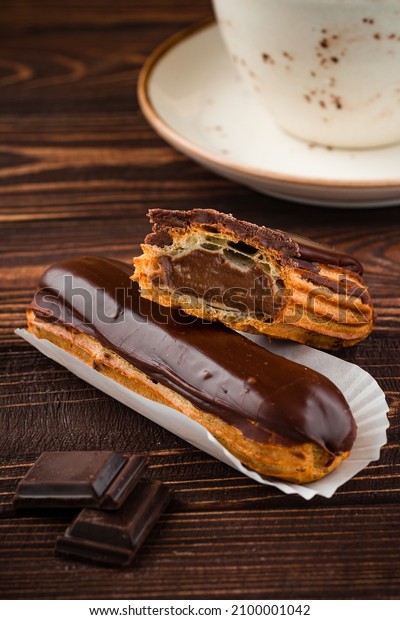 chocolate eclair,\
Traditional french dessert eclair with custard and chocolate icing\
Sweet pastry products
