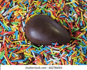 Chocolate Egg On The Background Of Easter Powder. ?lose Up