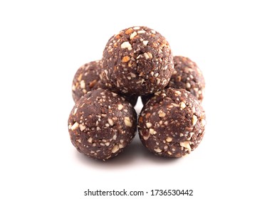 Chocolate Energy Protien Balls Made of Raw Organic Nuts and Dates Isolated on a White Background