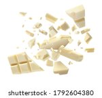 Chocolate explosion, pieces shattering on white background