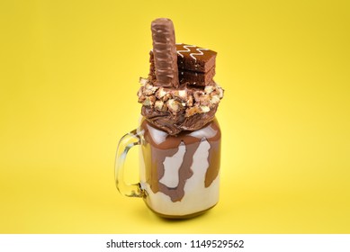 Chocolate Extreme Milkshake With Brownie Cake, Chocolate Paste And Sweets. Crazy Freakshake Food Trend. Copy Space